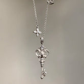 Vintage-Style Iris Key Pendant Necklace – 18K Gold Plated Light Luxury Sweater Chain & Exquisite Choker for Women